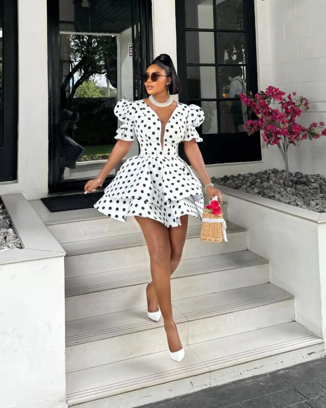 Polka dot dress with statement bags