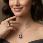 Model wearing Alexandrite gemstone rings and necklace