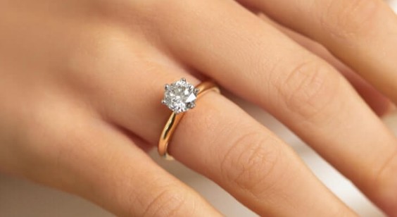 Hand wearing a diamond ring