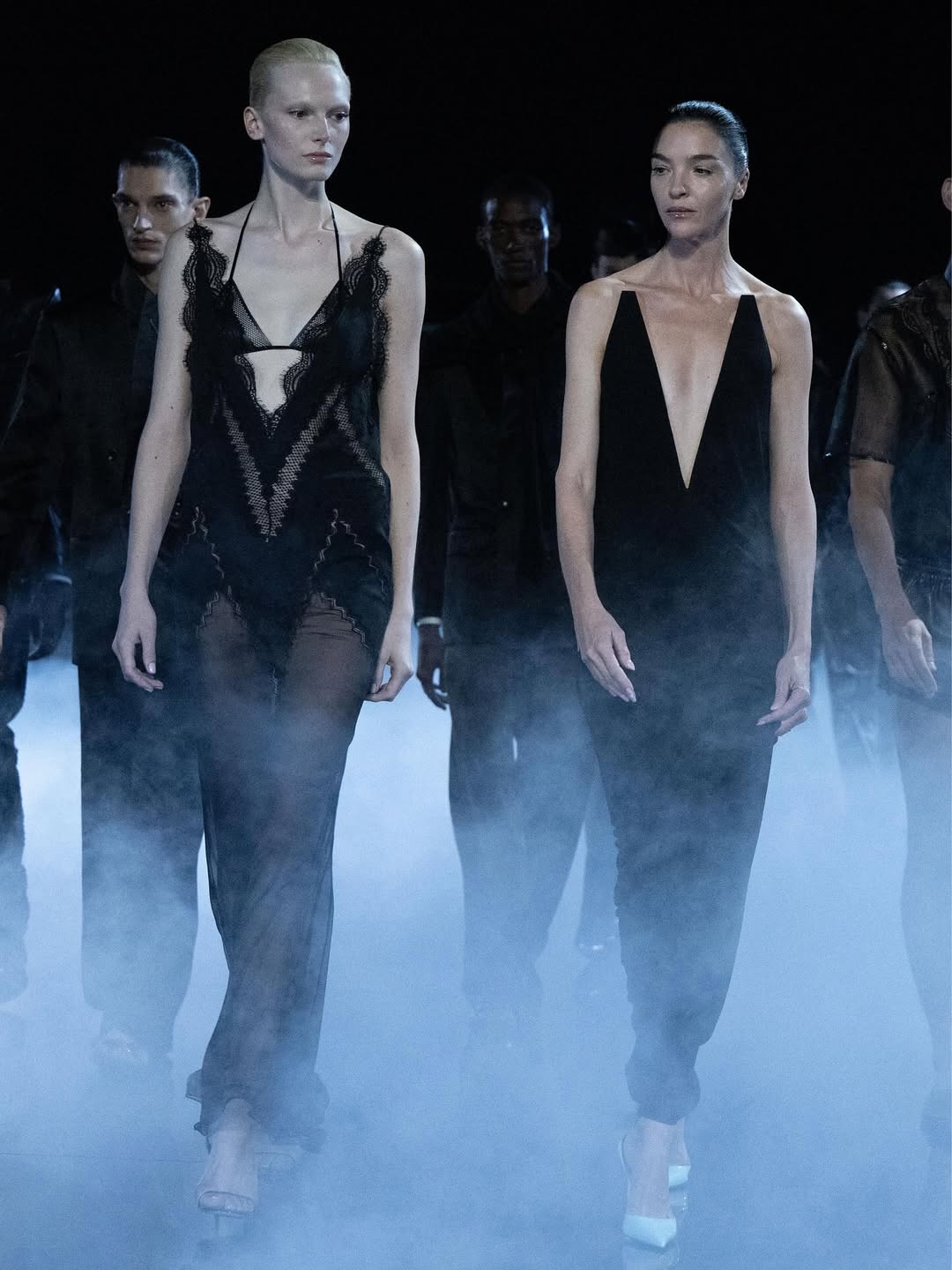 Alex Consani and Mariacarla Boscono are seen modeling black lace dresses during Tom Ford’s Spring/Summer 2026 presentation in Paris, France.