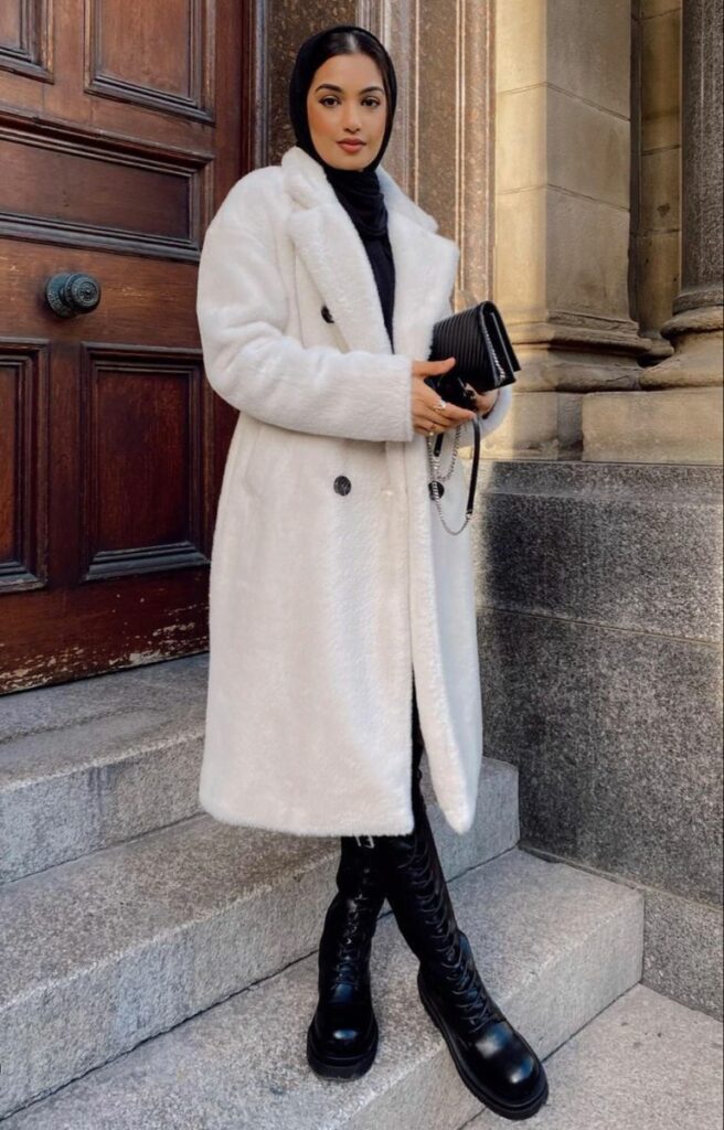 Model wearing Long white fur coat 