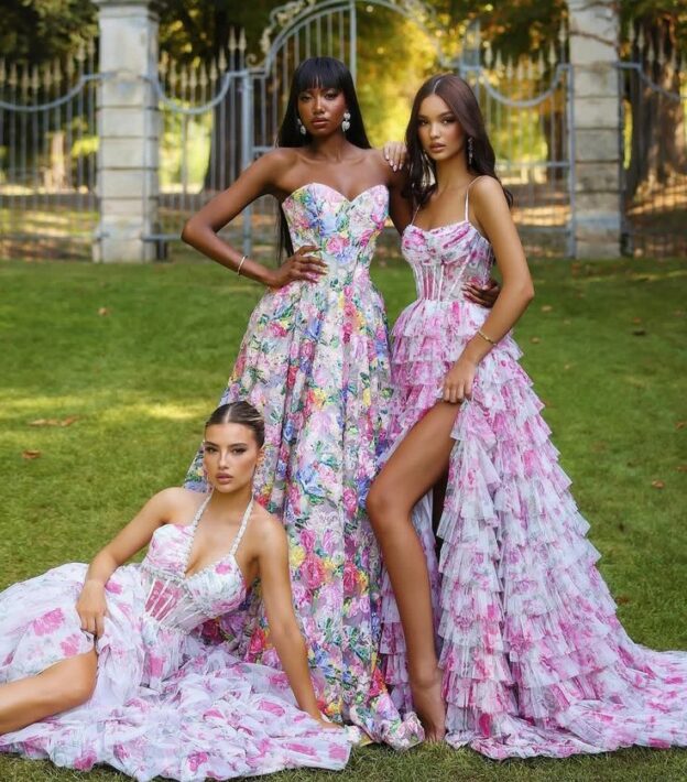 3 models in halter top floral dresses