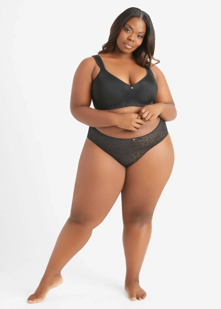 Large size female model in black plus-size lingerie panties and bra 