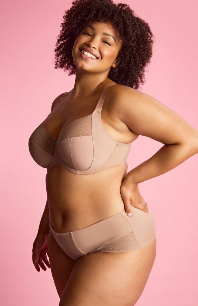 Large size model wearing pink panties and bra 