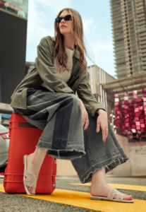 Model wearing biege sandals