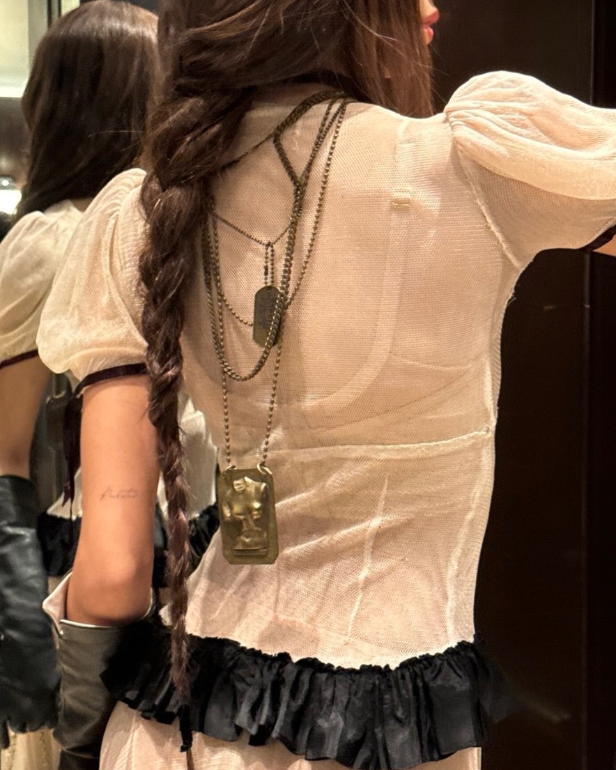 Pranpriya Manobal dressed up even more, choosing black elbow-length leather gloves to match her outfit and black Jimmy Choo platform pumps from the Marene Mary Jane line.