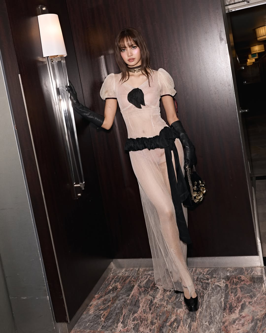 BLACKPINK Lisa attends the 2026 Golden Globes After-Party dressed elegantly in a two-tone Enfants Riches Déprimés (ERD) sheer maxi dress with Jimmy Choo Marene patent-leather Mary Jane pumps.