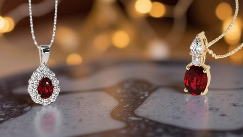 Two ruby pendants on a black uneven stone surface ruby necklace designs 