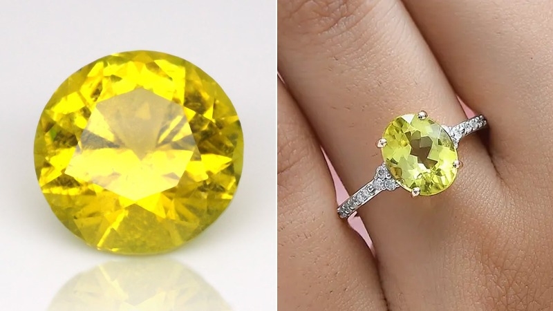 finger with yellow gemstones ring and a single yellow stone