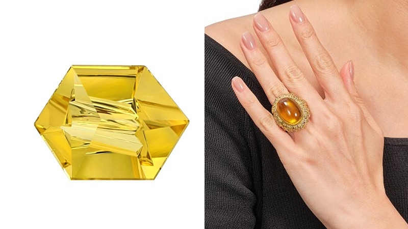 hand with yellow stone ring and 6 sided yellow stone