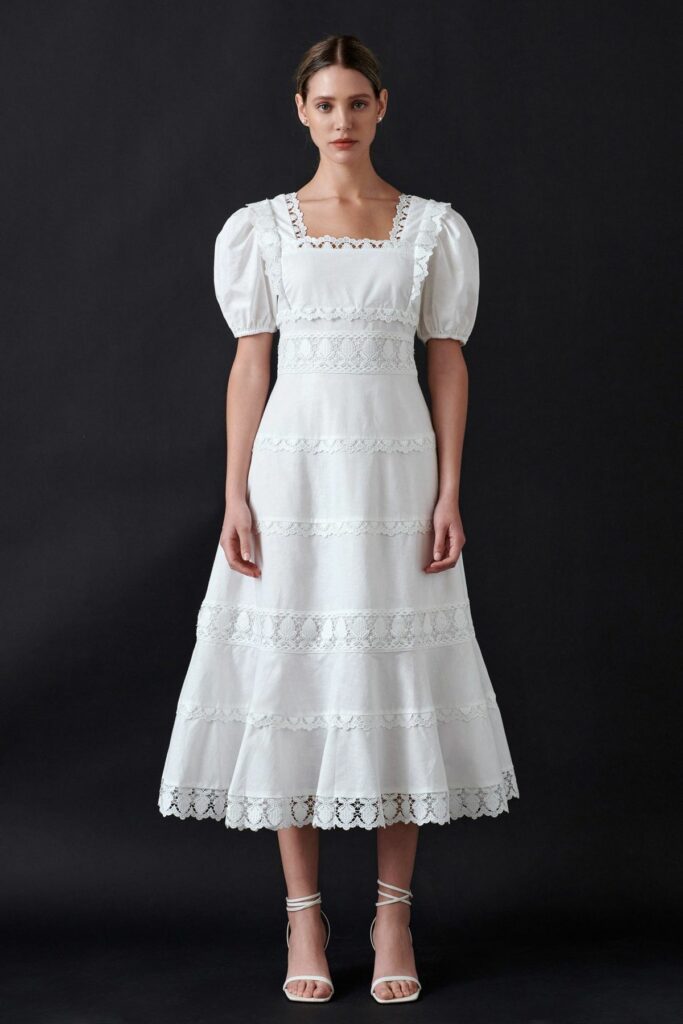 Model in simple white dress 