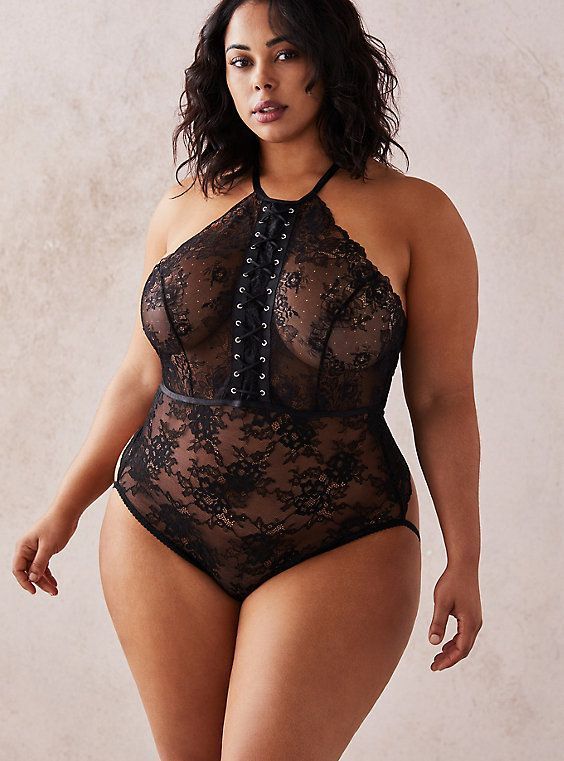 Large sized model wearing black lace body suit 