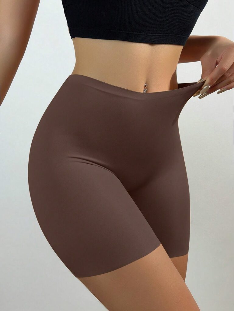 Model wearing brown shapewear bottoms 