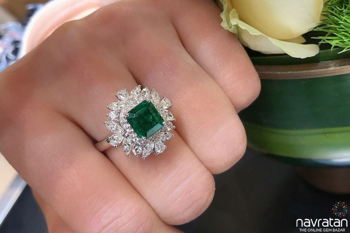 Hand wearing an Emerald Ring