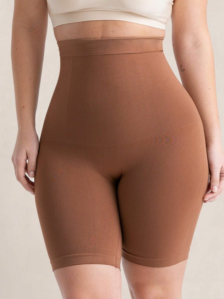 Model wearing brown shapewear bottoms 