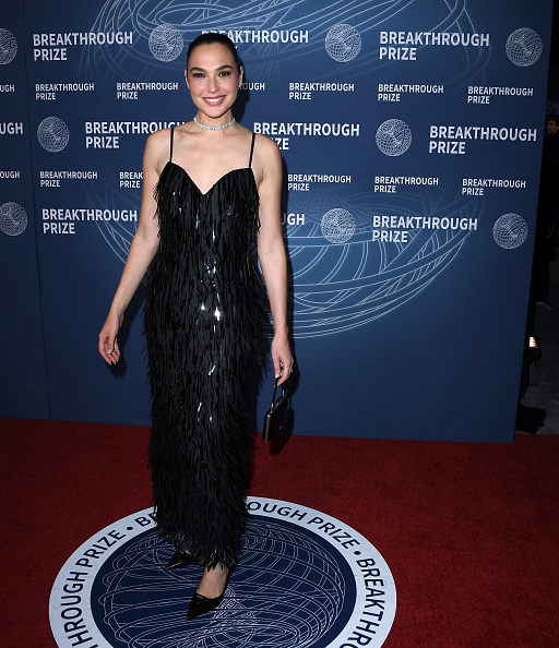 Gal Gadot shone under the ceremonial lights in a black sleeveless bespoke column dress by Prada at the 11th Breakthrough Prize Ceremony.