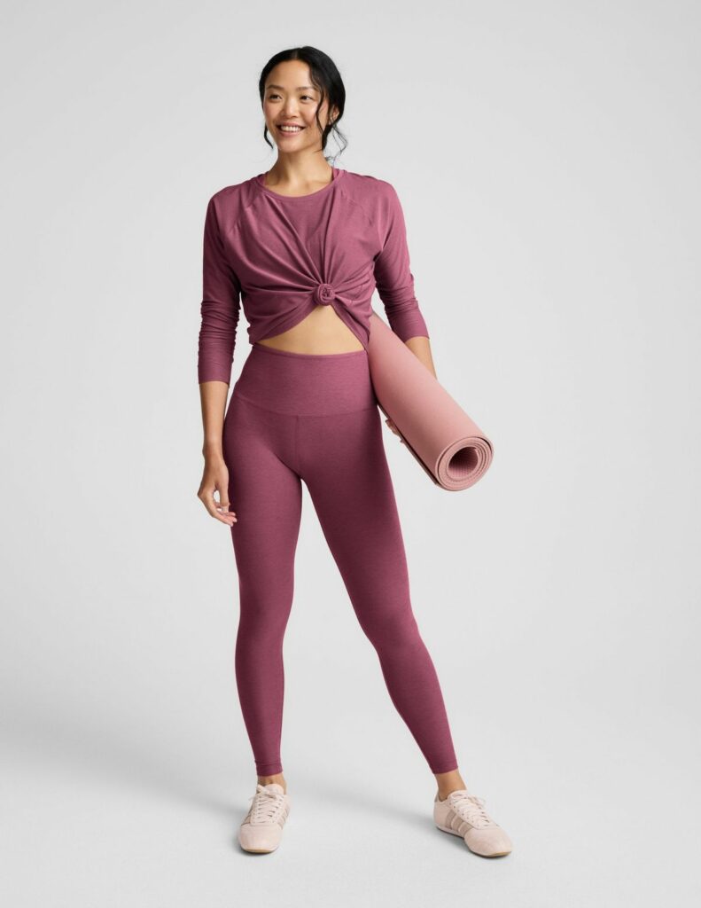 woman wearing example of yoga tops in maroon 