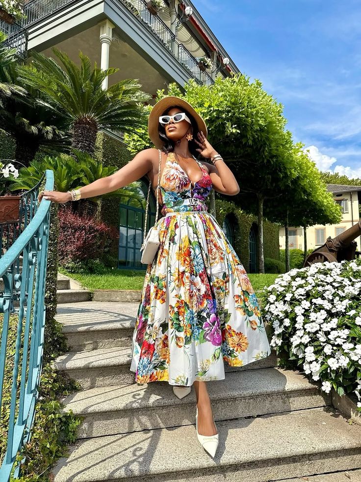 Model in long white floral printed maxi dress
