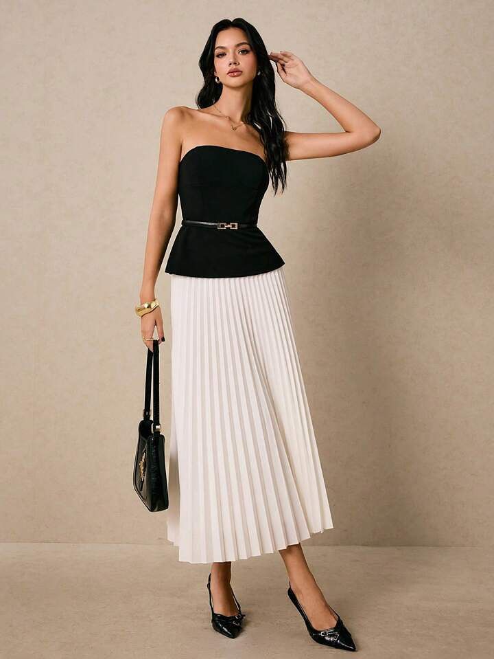 Model in slevless off the shouler peplum top and long white skirt 