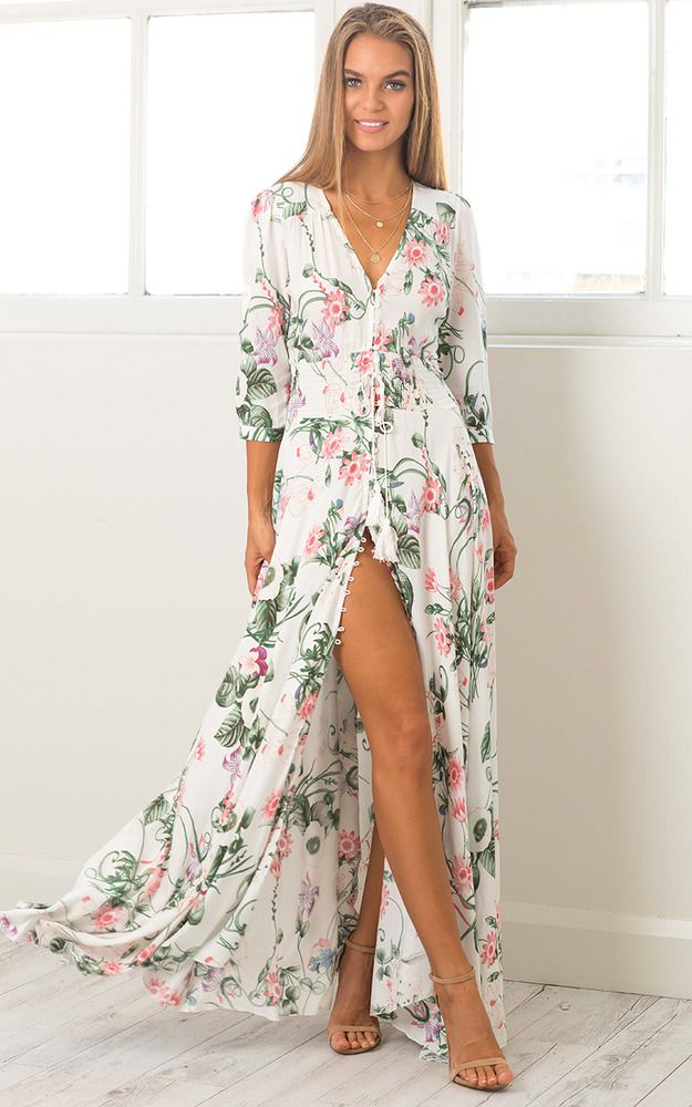 Model in white floral button up maxi dress 