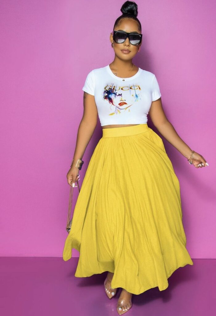 Model in white crop top and full length skirt to demonstrate  skirts for any body type 