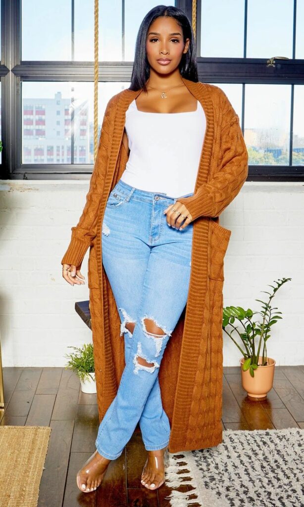 Model wearing rust brown Longline cardigans and ripped jeans 