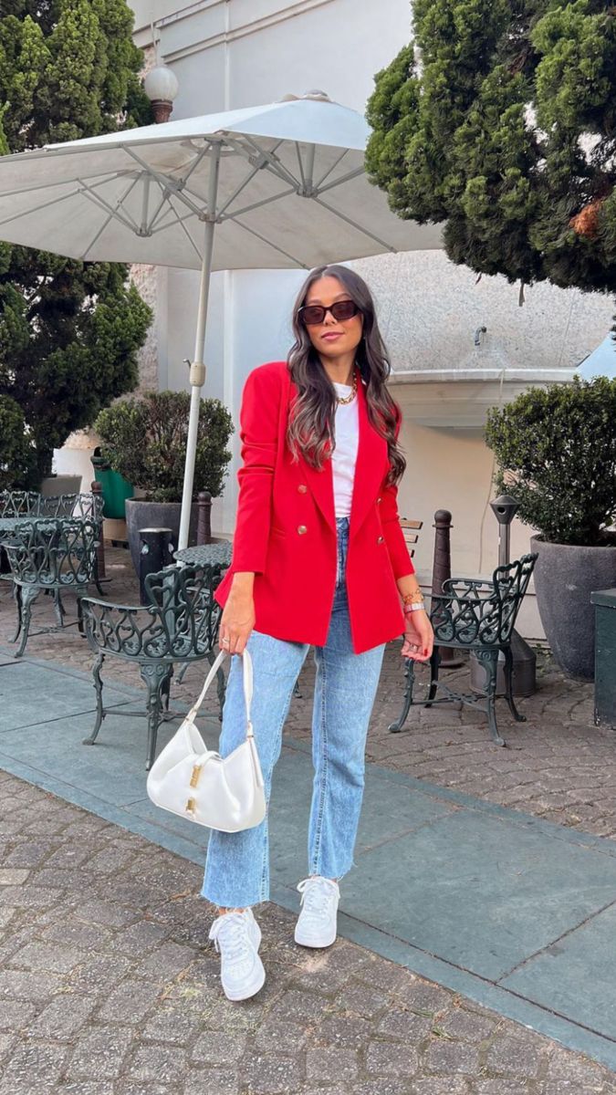 Red blazer paired with denim jeans