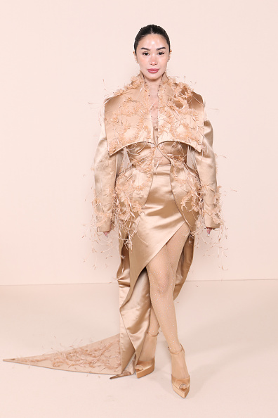 Heart Evangelista attended the Ashi Studio Haute Couture Spring/Summer 2026 collection show on day 4 of Paris Fashion Week, dressed in a satin coat with a shawl collar and a matching satin asymmetrical draped dress with a thigh-high slit and train.