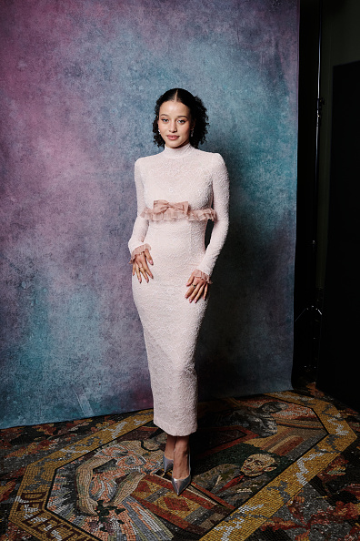 Chase Infiniti Payne attended the 2026 EE BAFTA Film Awards Nominees’ Party wearing a bow-embellished silk-organza-trimmed stretch-lace gown by Alessandra Rich, complemented by Christian Louboutin Miss Z 100 metallic leather heels and Jessica McCormack jewelry.