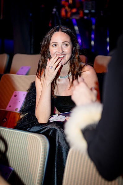 Renate Reinsve wore an 18k white-gold solitaire ring set with emerald-cut diamonds, complemented by a sleek black lacquer finish.