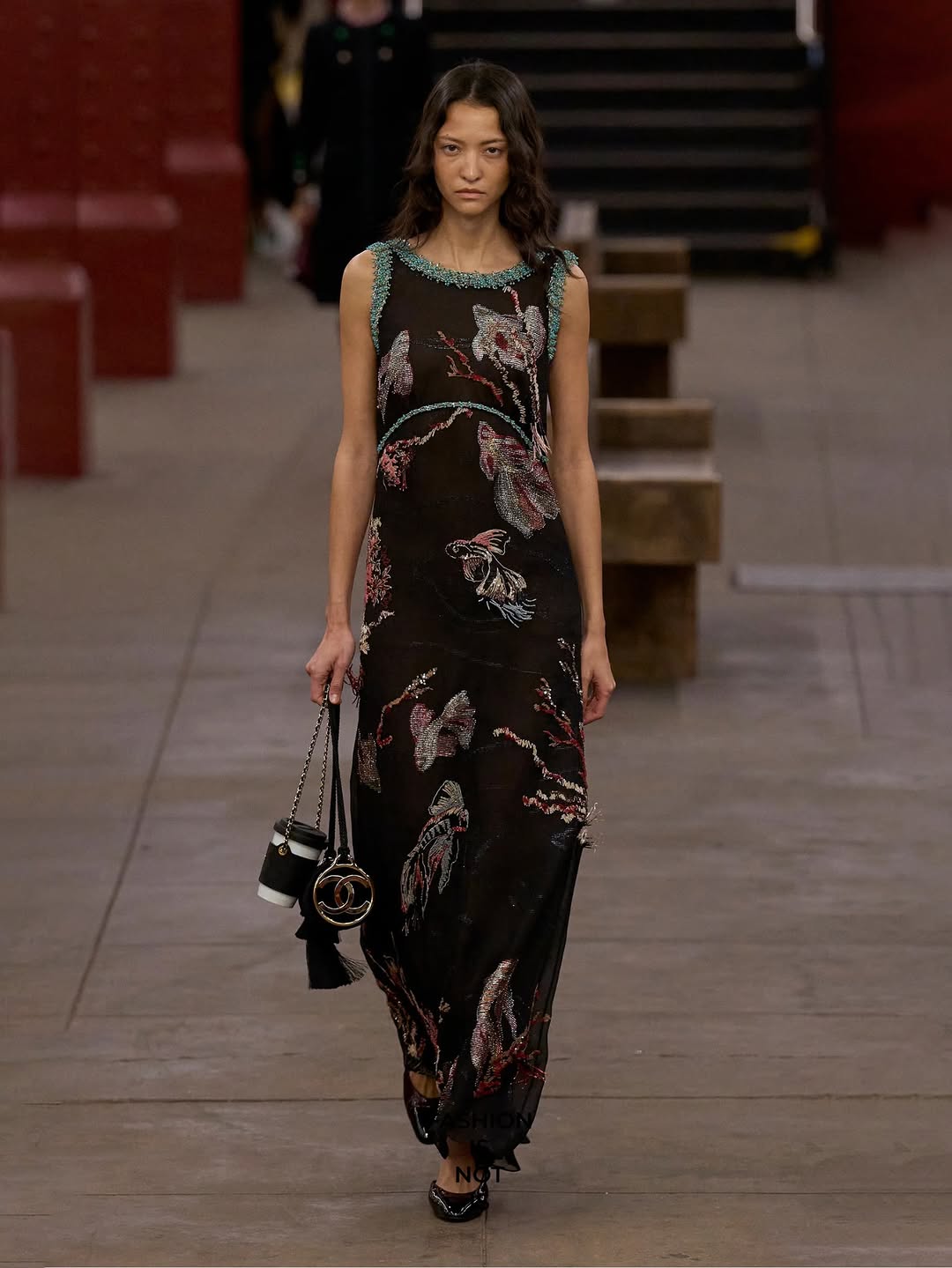 América González, a Venezuelan fashion model, appeared on the runway for the Chanel Métiers d’Art Pre-Fall 2026 ready-to-wear collection, wearing a sleeveless embroidered maxi dress.