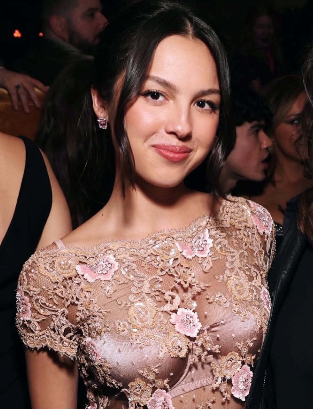 Olivia Rodrigo wore a short-sleeve Valentino floral-embroidered lace minidress, an Araks Lingerie two-piece Gita silk charmeuse balconette bra with an underwire frame, and a Gwyneth low-rise panty to the 2026 W Magazine, Charli XCX, and Saint Laurent Grammy After-Party.