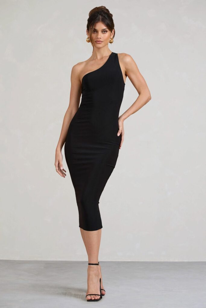 Model displaying current bodycon dress trends with a black asymmetrical neckline middi dress