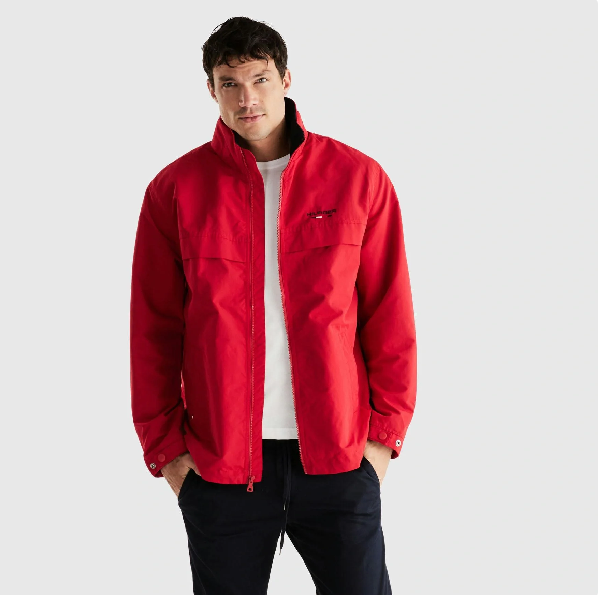 Model wearing red windbreaker 