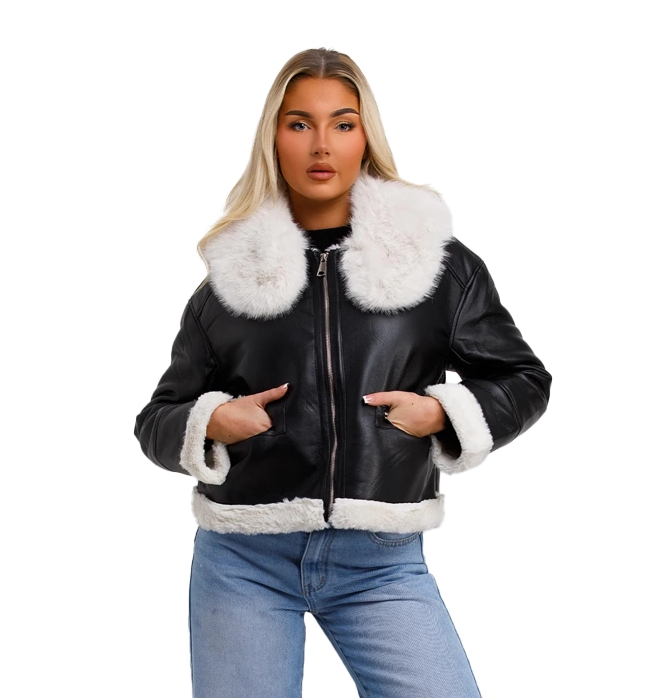 model in black leather with white fur lined collar and sleeves. coat 