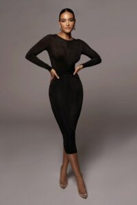 model in black bodycon dress