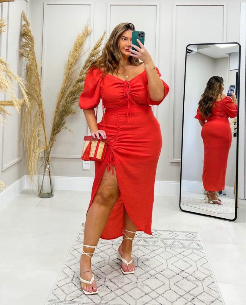 red off-shoulder top paired with high-slit midi skirt