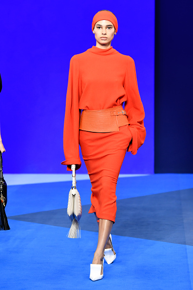 Annemary Aderibigbe walked the Lanvin Spring/Summer 2026 runway wearing a balloon-sleeved sweater and matching midi skirt, complete with an embossed quilted-pattern leather belt.