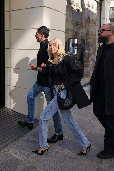 Rose in jeans, crop top and black blazer in Paris  with male escort 