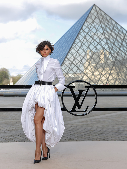 Zendaya graced the Louis Vuitton Womenswear Fall/Winter 2026-2027 collection runway at Paris Fashion Week on Tuesday, March 10, 2026, donning a Louis Vuitton collared shirt paired with an asymmetrical balloon skirt set, a leather belt, Louis Vuitton Gala heeled patent calf leather pumps, and Cartier accessories.