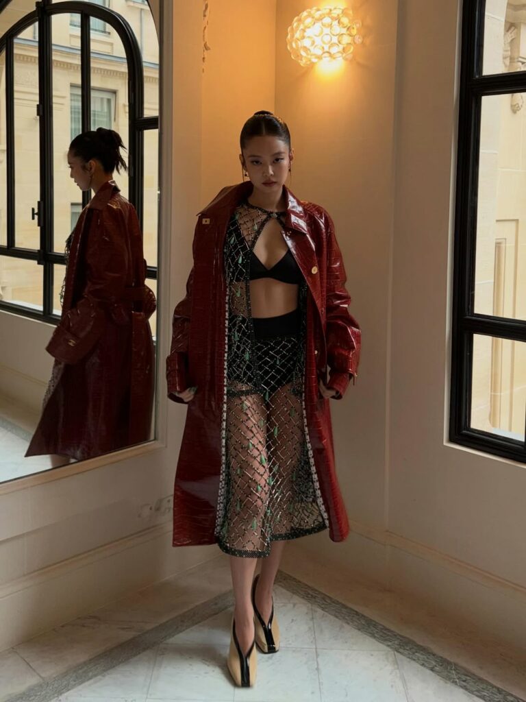 ennie Kim of Blackpink was spotted at the Chanel Womenswear Fall/Winter 2026-2027 presentation, wearing a Métiers d’Art 2026 croc-embossed leather coat