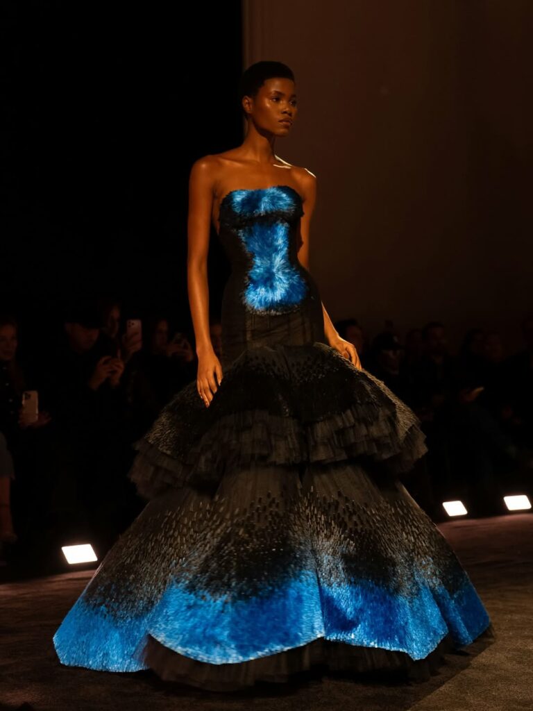 Model on the runway in Tiffany Celeste