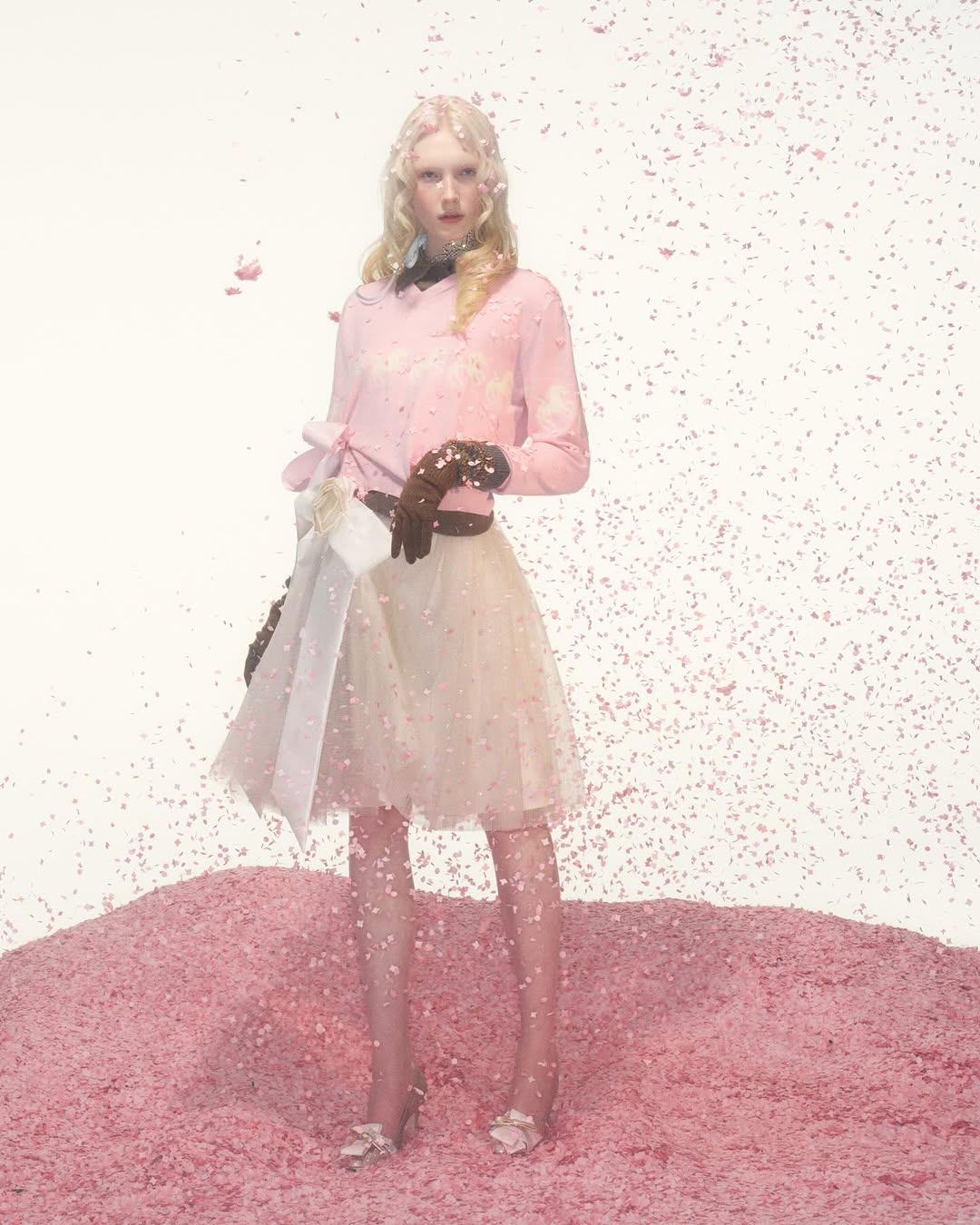 The August Barron Fall/Winter 2026 collection titled " Bedtime Story " featured a long-sleeve pink top paired with a knotted bow tulle miniskirt.