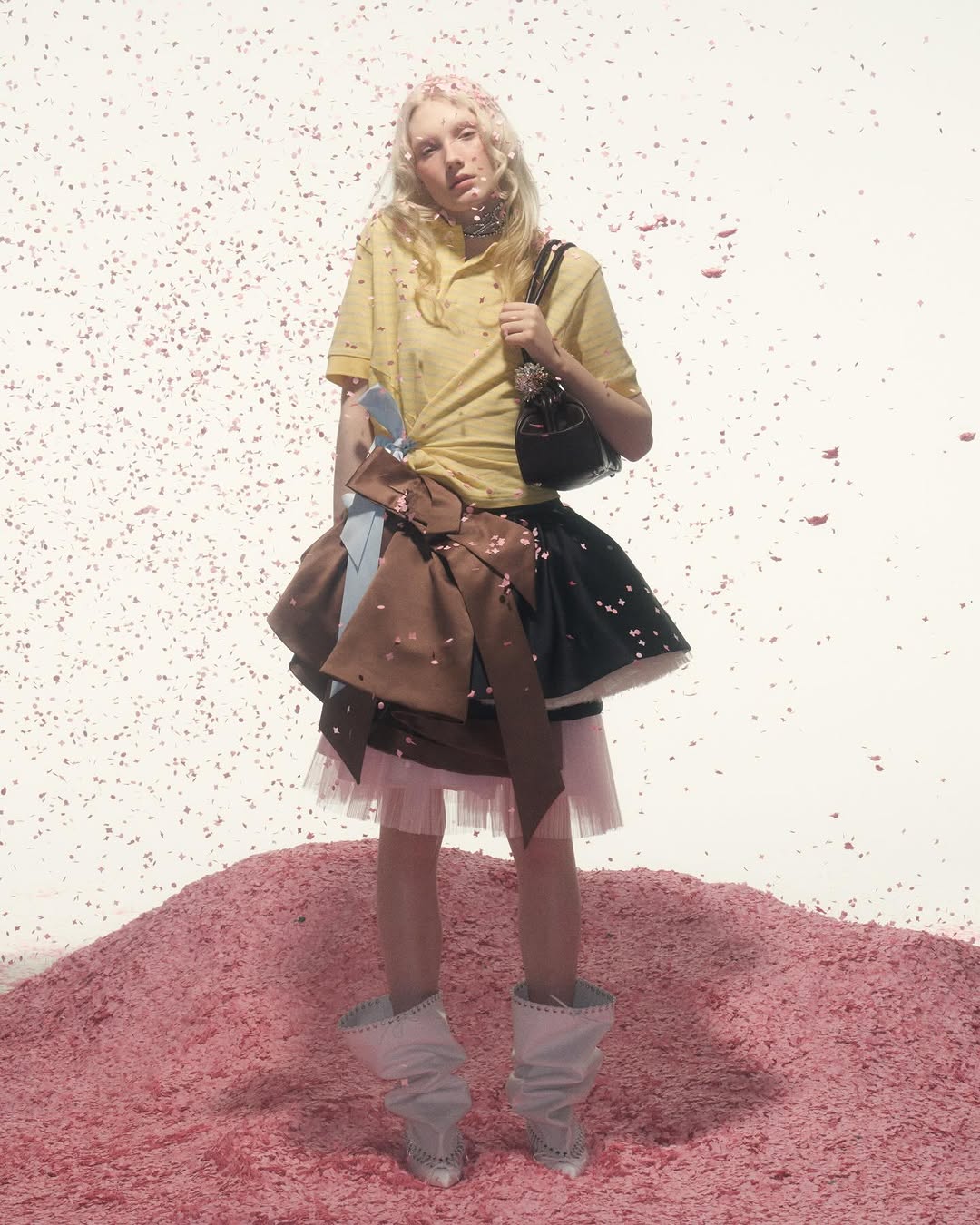 Ivy Stewart posed in a yellow polo shirt for August Barron’s Fall/Winter 2026/2027 “Bedtime Story” collection.