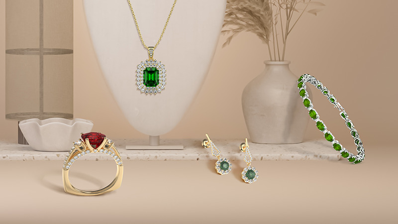 emerald pendant, alexandrite earrings, ruby ring, and peridot bracelet