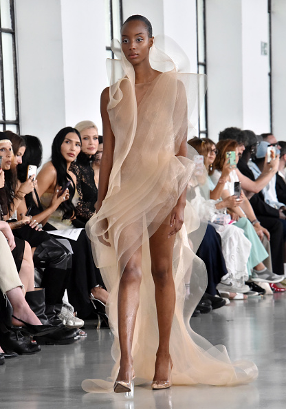 During Paris Fashion Week, Lever Couture unveiled its Haute Couture Fall/Winter 2025/2026 ready-to-wear collection, “Anatomy of Identity,” featuring a sleeveless layered organza gown with thigh-high slits.