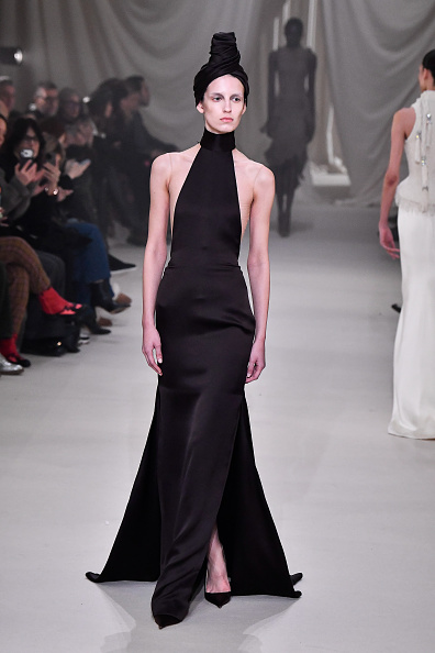 Valery Sergeeva was photographed striding the catwalk for the Ashi Studio Haute Couture Spring/Summer 2026 show, donning a backless satin turtleneck gown, a piece that Zendaya wore to the Los Angeles red carpet premiere of HBO’s “Euphoria,” Season 3.