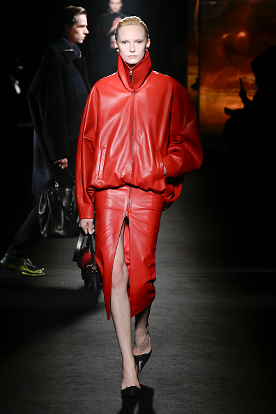 During Paris Fashion Week, Balenciaga unveiled a zipped leather jacket and thigh-high split leather skirt ensemble.