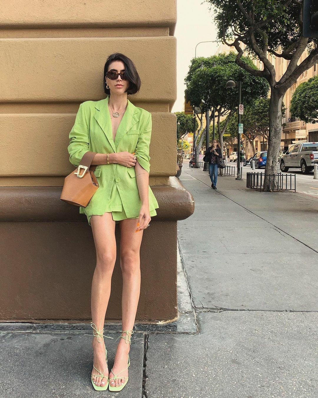 a woman is wearing green Square-Toe Shoes