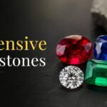 Headline: 'Most Expensive Gemstones in 2026' with a cluster of colorful jewels on a dark background on the right.